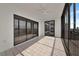 Enclosed lanai featuring sliding glass doors offering stunning water views and allowing for abundant natural light at 3630 Gulf Of Mexico Dr # 202, Longboat Key, FL 34228