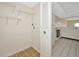 A tidy laundry room with shelving, hookups, and tiled flooring at 3630 Gulf Of Mexico Dr # 202, Longboat Key, FL 34228