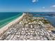 Stunning aerial shot of a coastal community featuring pristine beaches and luxurious waterfront living along a beautiful coastline at 3806 Gulf Of Mexico Dr # C204, Longboat Key, FL 34228