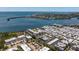 Aerial view of a condo complex with boat docks, pool, landscaping and a waterfront location with bay views at 3806 Gulf Of Mexico Dr # C204, Longboat Key, FL 34228