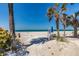 Picturesque beach view showcasing the sandy shore, clear ocean, and blue skies at 3806 Gulf Of Mexico Dr # C204, Longboat Key, FL 34228