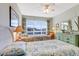 This bedroom features twin beds, dresser with mirror, and bright natural light from the window at 3806 Gulf Of Mexico Dr # C204, Longboat Key, FL 34228