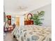 Comfortable main bedroom with adjacent bathroom, dresser with mirror, and closet at 3806 Gulf Of Mexico Dr # C204, Longboat Key, FL 34228