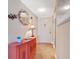 Inviting condo entryway with charming décor, including a seashell mirror and colorful accents at 3806 Gulf Of Mexico Dr # C204, Longboat Key, FL 34228