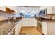 Updated kitchen with stainless steel appliances, granite countertops, and ample cabinet space at 3806 Gulf Of Mexico Dr # C204, Longboat Key, FL 34228