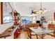 Comfortable living area with tile flooring, view of water, ceiling fan, plants, ladder style bookcase at 3806 Gulf Of Mexico Dr # C204, Longboat Key, FL 34228