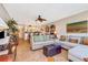Relaxing living area with tile floors, comfortable seating, and decor with a view into the kitchen at 3806 Gulf Of Mexico Dr # C204, Longboat Key, FL 34228