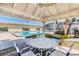View of the pool area from a shaded gazebo with seating at this lovely community at 3806 Gulf Of Mexico Dr # C204, Longboat Key, FL 34228
