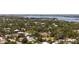 Captivating aerial view of a charming neighborhood nestled amidst mature trees near the water at 3921 Maravic Pl, Sarasota, FL 34231
