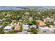 Beautiful aerial view showcasing a neighborhood surrounded by trees and waterfront access at 3921 Maravic Pl, Sarasota, FL 34231