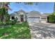 Stunning home featuring manicured front yard, two-car garage, and an eye-catching architectural design at 3921 Maravic Pl, Sarasota, FL 34231