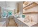Beautiful kitchen featuring stainless appliances, stone countertops, pendant lighting, and wood floors at 3921 Maravic Pl, Sarasota, FL 34231