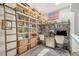 Cozy office space features custom shelving with ladder and modern décor at 3921 Maravic Pl, Sarasota, FL 34231