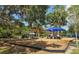 A colorful and inviting neighborhood playground featuring swings, slides, and shaded areas for enjoyment at 3921 Maravic Pl, Sarasota, FL 34231
