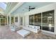 Relaxing screened-in pool area with ample seating and lush greenery visible from the patio at 3921 Maravic Pl, Sarasota, FL 34231