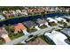 Community aerial view of homes along a serene lake, providing a tranquil setting at 4257 Hearthstone Dr, Sarasota, FL 34238