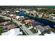 Expansive community aerial view showcasing homes bordering a beautiful lake at 4257 Hearthstone Dr, Sarasota, FL 34238