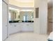 Bathroom featuring double vanity, ample counter space, and walk-in shower at 4257 Hearthstone Dr, Sarasota, FL 34238