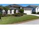 Charming single-story home boasts a well-manicured lawn and beautiful landscaping at 4257 Hearthstone Dr, Sarasota, FL 34238