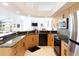 Beautiful kitchen with granite countertops and modern appliances, perfect for cooking at 4257 Hearthstone Dr, Sarasota, FL 34238