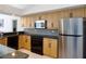 Efficient kitchen with stainless steel appliances and ample cabinet space at 4257 Hearthstone Dr, Sarasota, FL 34238