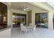 Covered patio with outdoor table and chairs at 4257 Hearthstone Dr, Sarasota, FL 34238