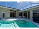 Relaxing pool with screen enclosure, patio, and outside dining area at 4257 Hearthstone Dr, Sarasota, FL 34238