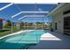 Inviting screened-in pool area with lake view, ideal for leisure and outdoor enjoyment at 4257 Hearthstone Dr, Sarasota, FL 34238