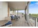 Spacious balcony with chairs, a table, and peaceful waterfront views at 4321 Marina View Way, Cortez, FL 34215