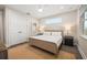 Comfortable bedroom with natural light, a ceiling fan, and neutral decor at 4321 Marina View Way, Cortez, FL 34215