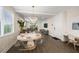 Elegant dining area with modern chandelier, comfortable seating, and open concept design at 4321 Marina View Way, Cortez, FL 34215