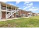 Brick apartment complex with white staircases and green grass at 4507 9Th W St # A2, Bradenton, FL 34207
