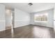Cozy living area featuring updated floors and neutral wall color, with large windows at 4507 9Th W St # A2, Bradenton, FL 34207