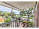 Inviting covered porch with chairs for relaxing and enjoying the outdoor scenery at 4507 9Th W St # A2, Bradenton, FL 34207