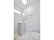 Bright bathroom featuring a modern vanity, mirror, and classic white tile flooring at 5213 Bel Air Ave, Sarasota, FL 34234