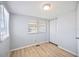 Cozy bedroom with natural light, hardwood floors, and a closet for storage at 5213 Bel Air Ave, Sarasota, FL 34234