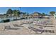 Relaxing pool area featuring a shaded tiki hut and comfortable lounge chairs at 5213 Bel Air Ave, Sarasota, FL 34234