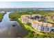 Beautiful aerial view showcasing the condo's waterfront location and lush surroundings at 5450 Eagles Point Cir # 404, Sarasota, FL 34231