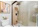 Modern bathroom featuring a glass-enclosed shower with a rainfall showerhead and designer fixtures at 5450 Eagles Point Cir # 404, Sarasota, FL 34231