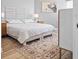 Comfortable bedroom with a well-made bed, neutral tones, and a decorative rug at 5450 Eagles Point Cir # 404, Sarasota, FL 34231