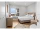 Bright bedroom with a large window, closet, and neutral furnishings at 5450 Eagles Point Cir # 404, Sarasota, FL 34231