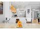 Bright dining area with a modern table, white chairs, and stylish pendant lighting at 5450 Eagles Point Cir # 404, Sarasota, FL 34231