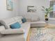 Stylish living room with a comfortable sectional sofa, hardwood floors, and elegant decor at 5450 Eagles Point Cir # 404, Sarasota, FL 34231