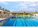 Sparkling swimming pool with clear blue water, lounge seating, and a cabana area at 5450 Eagles Point Cir # 404, Sarasota, FL 34231