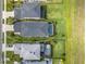 Aerial view of the property featuring a private screened pool with lush landscaping at 5532 Summit Gln, Bradenton, FL 34203