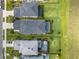 Aerial view of the property featuring a private screened pool with lush landscaping at 5532 Summit Gln, Bradenton, FL 34203