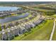 A picturesque aerial view of the community with a scenic lake and lush landscaping, showcasing the home's prime location at 5532 Summit Gln, Bradenton, FL 34203