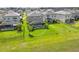 An aerial view of backyard featuring well-maintained lawn and screened-in pool area, great for outdoor relaxation and entertaining at 5532 Summit Gln, Bradenton, FL 34203