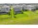 An aerial view of backyard featuring well-maintained lawn and screened-in pool area, great for outdoor relaxation and entertaining at 5532 Summit Gln, Bradenton, FL 34203