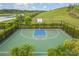 Community basketball court surrounded by tropical palm trees at 5532 Summit Gln, Bradenton, FL 34203